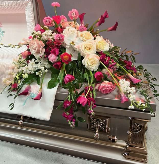 Assortment of flowers on casket