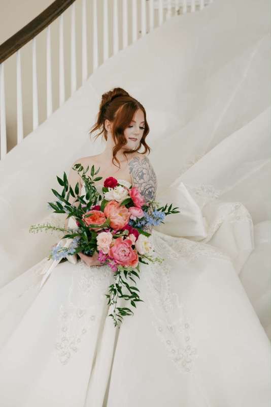 Bride with colorful bouquet close up