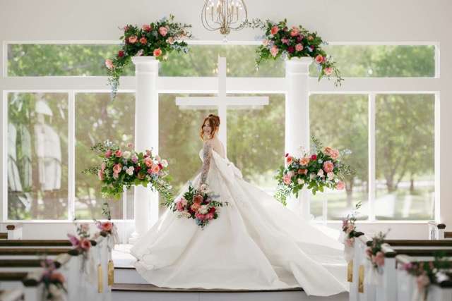 Bride with colorful bouquet far away